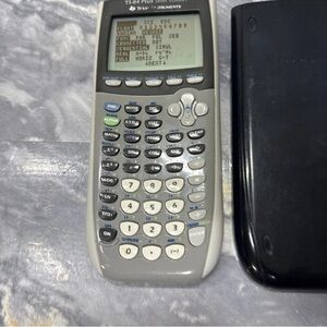 Texas Instruments TI-84 Plus Graphing Calculator in Gray and Black